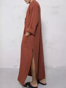 Traditional men's loose long robe in solid rust color with side slits and pockets