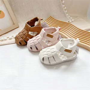 Close-up of three colors of woven leather baby sandals showing texture and velcro straps