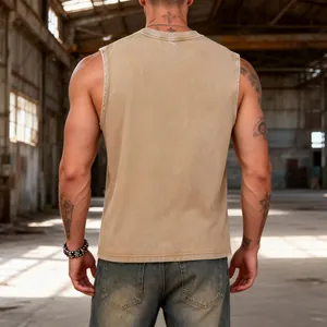 Back view of a vintage khaki washed cotton sleeveless vest for men in industrial setting