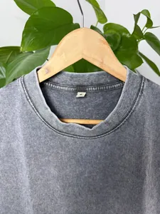 Close-up of vintage washed grey cotton tank top collar with size tag and fabric detail