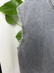 Close-up of vintage acid washed heavy cotton fabric and armhole on gray tank top