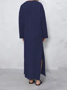 Back view of a minimalist navy blue long-sleeved robe with side slits for men
