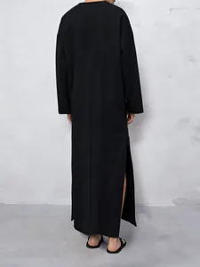 Modern minimalist black long sleeve kaftan robe for men in loose fit style back view