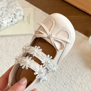 Sweet girls' cream princess shoes featuring lace flowers pearl straps and bow accent