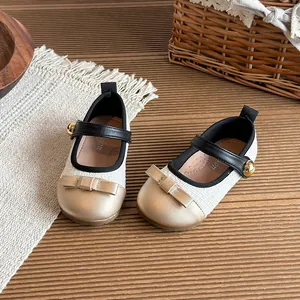 Elegant cream tweed Mary Jane shoes for toddler girls featuring a gold bow accent