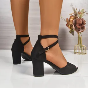 Side view of elegant black cross strap chunky heel sandals with peep toe design for women