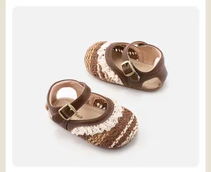 Detailansicht der handgewebten Muster und Spitzenborte an Baby-Mädchen Sandalen