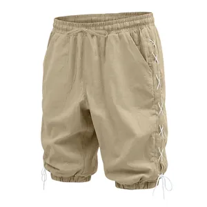 Detail of men's beige linen 3/4 pants featuring lace-up sides and drawstring waist
