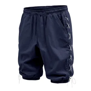 Detailed view of the navy blue linen cropped pants with side white lace-up design