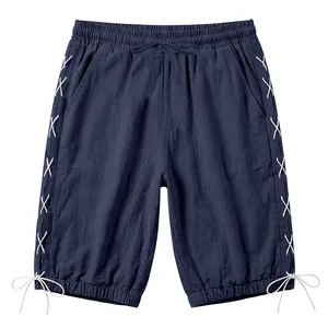 Detail showing navy linen Capri shorts with stylish side lacing and drawstring waist