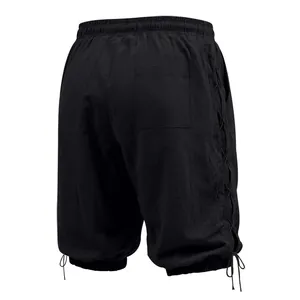 Back view of black men's linen cropped pants featuring side lace-up detail and back pocket