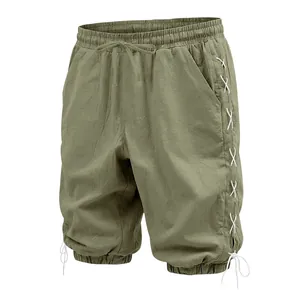 Detailed view of olive green linen drawstring shorts with white side lace-up design