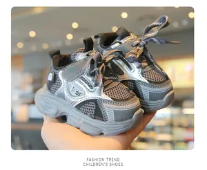 Detail of breathable mesh toddler sneakers in grey and silver with velcro strap