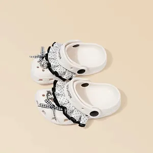White girls' clogs with polka dot ruffles and stylish gingham bows for summer comfort