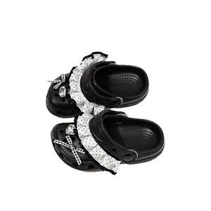 Black girls' polka dot clog shoes with ruffles and bow decoration