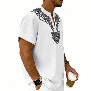 Close-up detail of men's white linen V-neck shirt with black Celtic knot rune print.