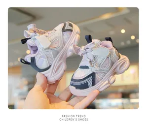 Close-up of pink breathable mesh toddler sneakers with soft non-slip thick soles