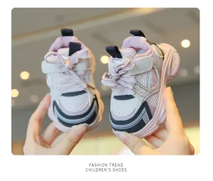 Close-up of pink breathable mesh baby sneakers with soft non-slip soles for girls