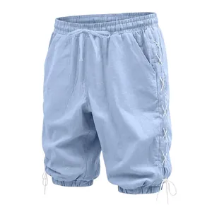 Detailed view of light blue linen 3/4 pants with drawstring and side lace-up design