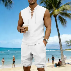 Full body shot of a man wearing a white sleeveless linen beach set in a sunny resort