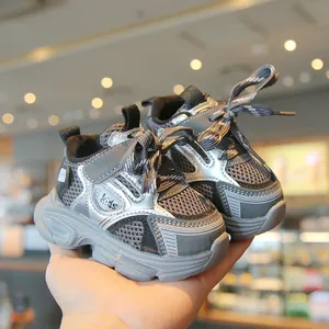 Breathable mesh toddler sneakers with soft non-slip soles in grey and silver finish.