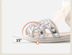 Detail of sequined baby girl princess sandal showing 15-degree ergonomic toe lift