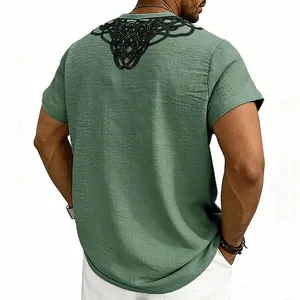 Close-up of men's green slub linen t-shirt featuring a black runic knot print on back
