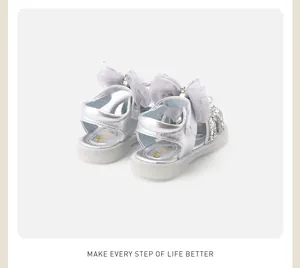Rear view of silver baby princess shoes featuring sequin bows and soft soles