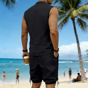 Back view of men's black linen sleeveless shirt and drawstring shorts set on beach.