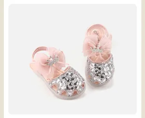 Macro view of toddler princess shoes featuring sparkling sequins and a crown bow detail