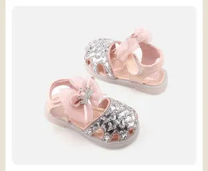Pink baby princess sandals featuring silver sequins and a delicate bow with a crown