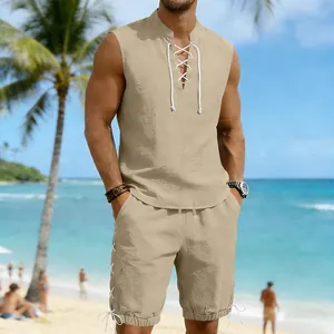 Detailed shot of men's khaki linen casual set with lace-up collar and drawstring shorts on beach