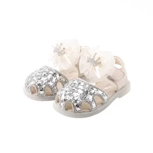 Elegant baby girl princess sandals featuring silver sequins and a crown bow knot design