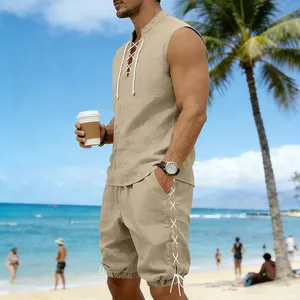 Macro detail of men's sleeveless linen shirt and drawstring shorts outfit on beach