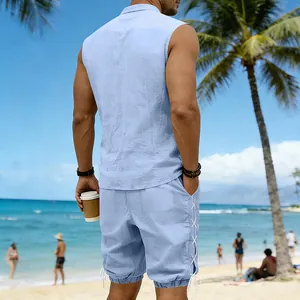 Back view of men's light blue sleeveless shirt and shorts set in a beach setting