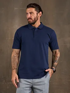 Detailed front view of a men's navy blue short-sleeved Polo shirt worn by a model