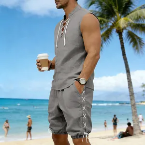 Lifestyle view of grey sleeveless linen top and shorts set with lace-up side detail