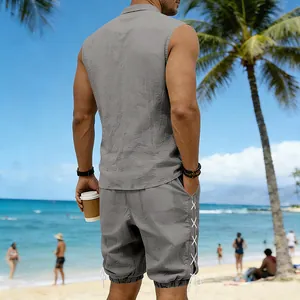 Detail of grey sleeveless linen shirt and lace-up shorts set for beach holiday.