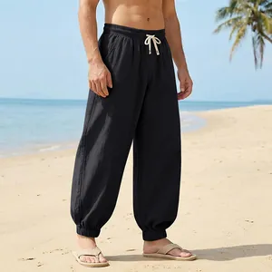 Loose black linen beach trousers for men with elasticated drawstring waist and cuffs