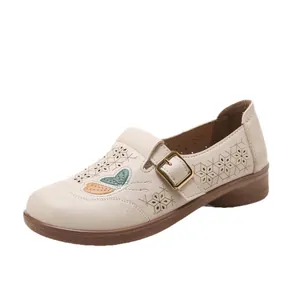 Comfortable beige women's loafers with butterfly embroidery and decorative buckle strap