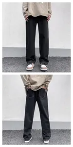 Front and back view details of men's black straight leg jeans featuring contrast stitching
