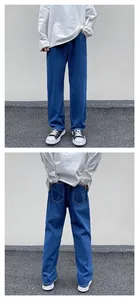 Front and back views of men's loose straight-leg denim jeans in deep blue