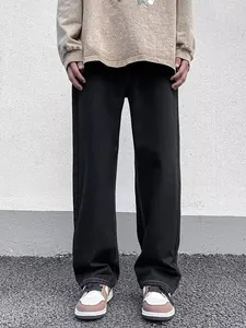 Men's straight leg black jeans with contrast stitching in a relaxed streetwear fit