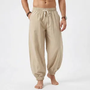Men's loose khaki linen beach joggers with elastic drawstring waist and side pockets.