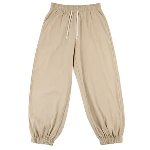 Detailed view of men's loose linen casual joggers with drawstring waist and elastic cuffs