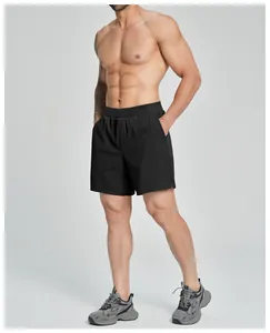 Full length view of black men's quick-dry athletic shorts for gym and outdoor sports