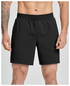 Detail of men's black quick-dry athletic shorts with elastic waistband for fitness