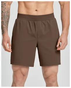 Detail of brown quick-dry men's athletic shorts with elastic waistband and stretch fabric