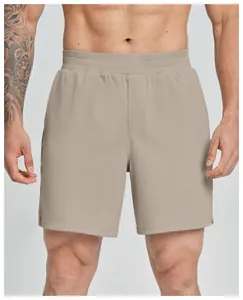 High-quality men's khaki quick-dry athletic sports shorts shown in detail on model