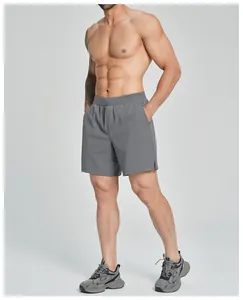 Detail view of men's grey quick-dry sports shorts for fitness and outdoor gym